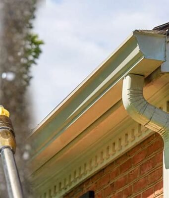 Pressure washing gutter cleaning